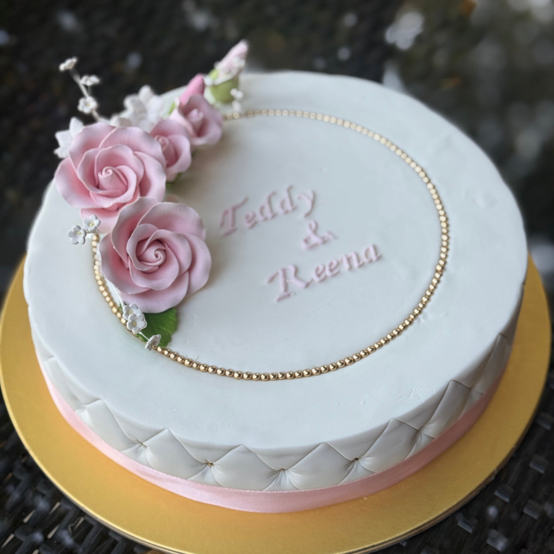 Decorated Sugee cake in pink trimmings