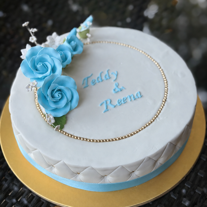 Decorated Sugee cake in blue trimmings