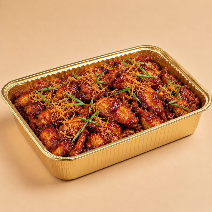 Quentin’s fried devilled wings in a gold mini buffet tray